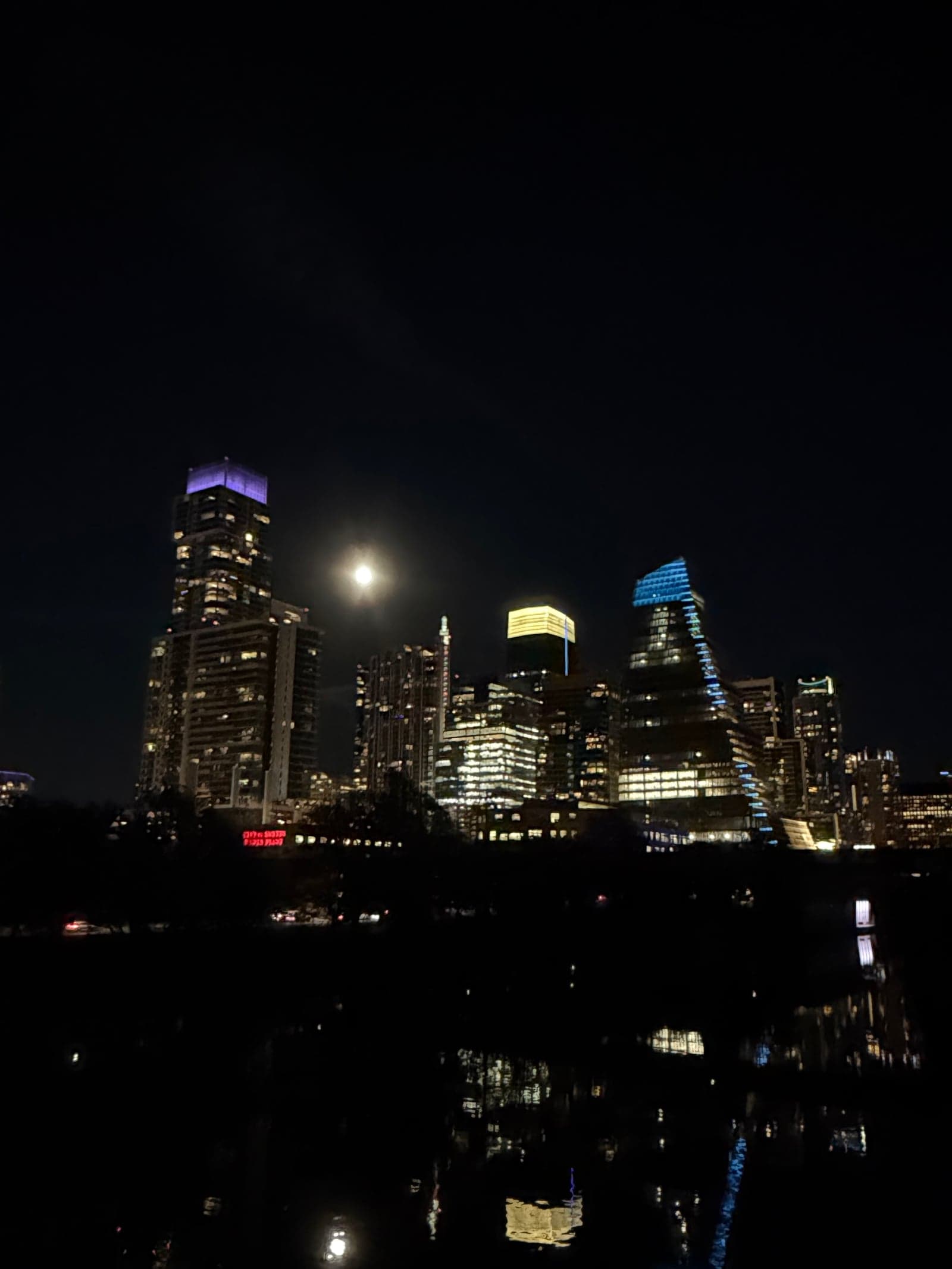 the moon seen from pfluger pedestrian bridge